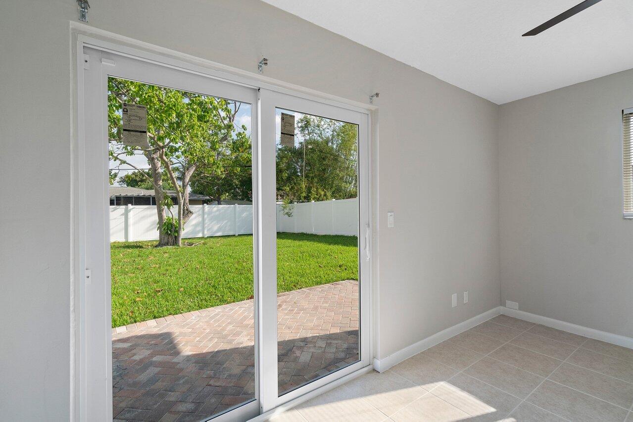 209 Southwest 6th Street, Unit 209 Boca Raton, FL 33432 - Photo 25 of 37 a view of a porch with a backyard