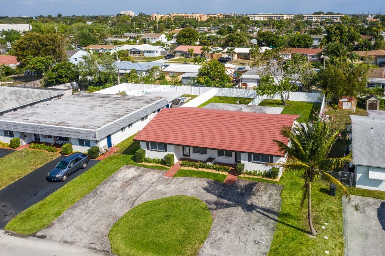 209 Southwest 6th Street, Unit 209 Boca Raton, FL 33432 - Photo 29 of 37 an aerial view of residential houses with outdoor space and swimming pool