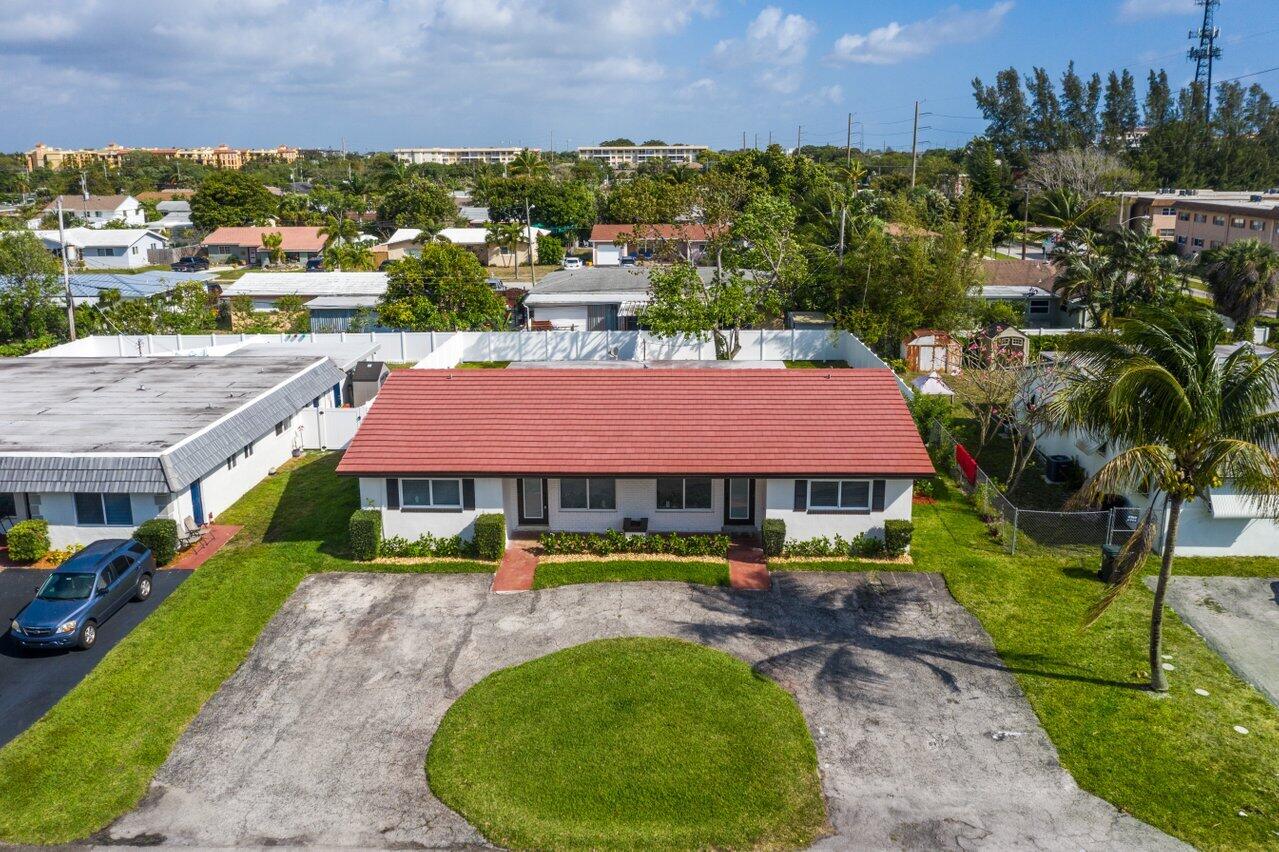 209 Southwest 6th Street, Unit 209 Boca Raton, FL 33432 - Photo 31 of 37 aerial view of a house with garden and patio