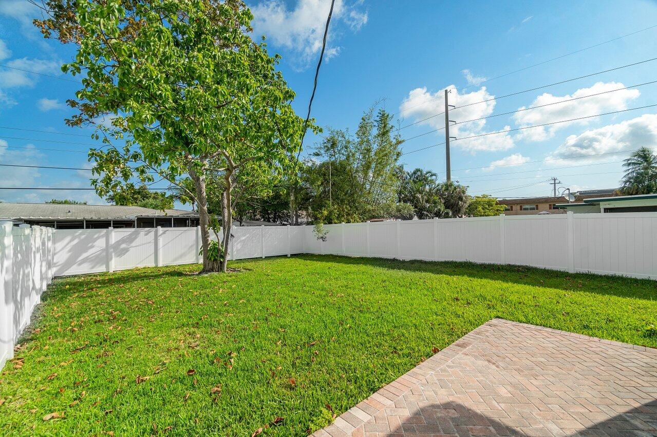 209 Southwest 6th Street, Unit 209 Boca Raton, FL 33432 - Photo 6 of 37 a view of a back yard
