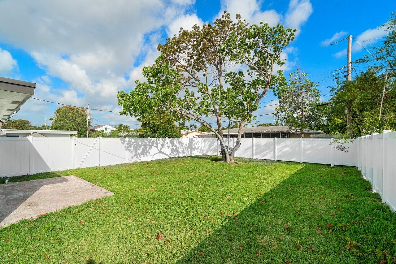 209 Southwest 6th Street, Unit 209 Boca Raton, FL 33432 - Photo 7 of 37 a view of yard with swimming pool