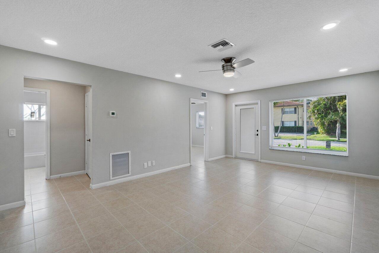 209 Southwest 6th Street, Unit 209 Boca Raton, FL 33432 - Photo 10 of 37 a view of an empty room with a window