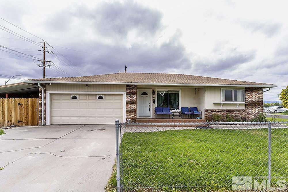 4400 Persimmon Road Reno, NV 89502 - Photo 1 of 18 a front view of house with yard and outdoor seating