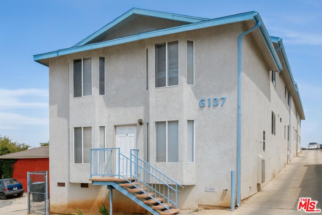 6137 Toltec Way, Unit 7 Los Angeles, CA 90042 - Photo 1 of 8 a front view of a house with garage