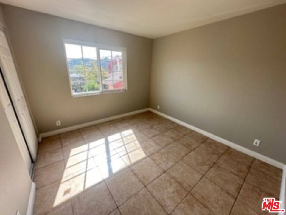 6137 Toltec Way, Unit 7 Los Angeles, CA 90042 - Photo 5 of 8 an empty room with windows