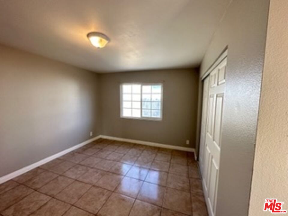 6137 Toltec Way, Unit 7 Los Angeles, CA 90042 - Photo 6 of 8 a view of an empty room and window