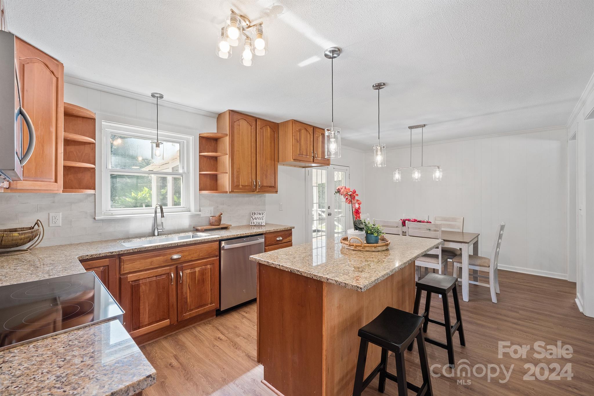 507 Shue Road China Grove, NC 28023 - Photo 11 of 34 a kitchen with a table chairs sink and cabinets