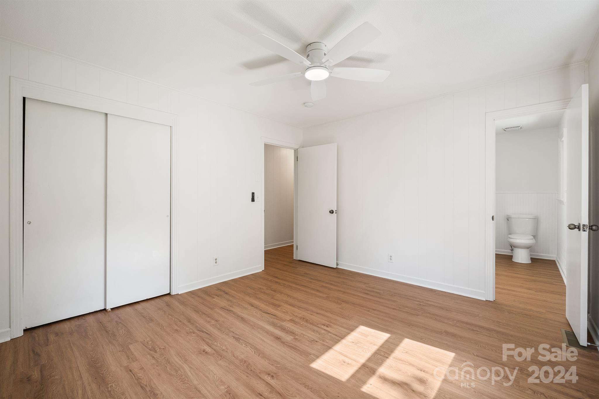 507 Shue Road China Grove, NC 28023 - Photo 24 of 34 an empty room with wooden floor and a ceiling fan