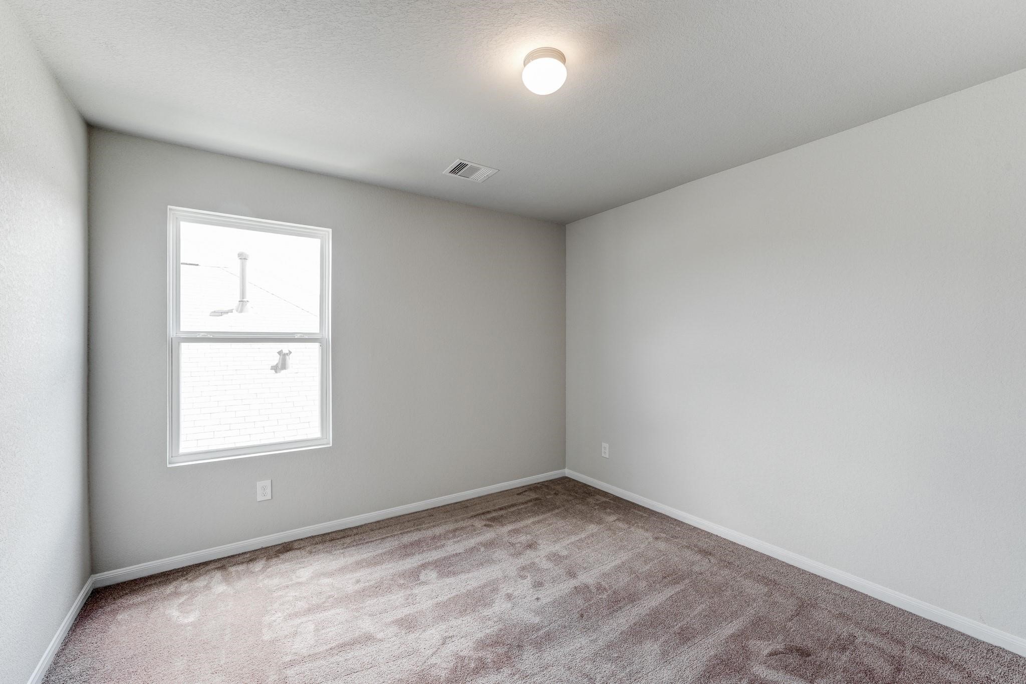 1015 Willowick Road Houston, TX 77090 - Photo 33 of 42 Bedroom #4 offering lots of space for multiple beds or a KING size bed!