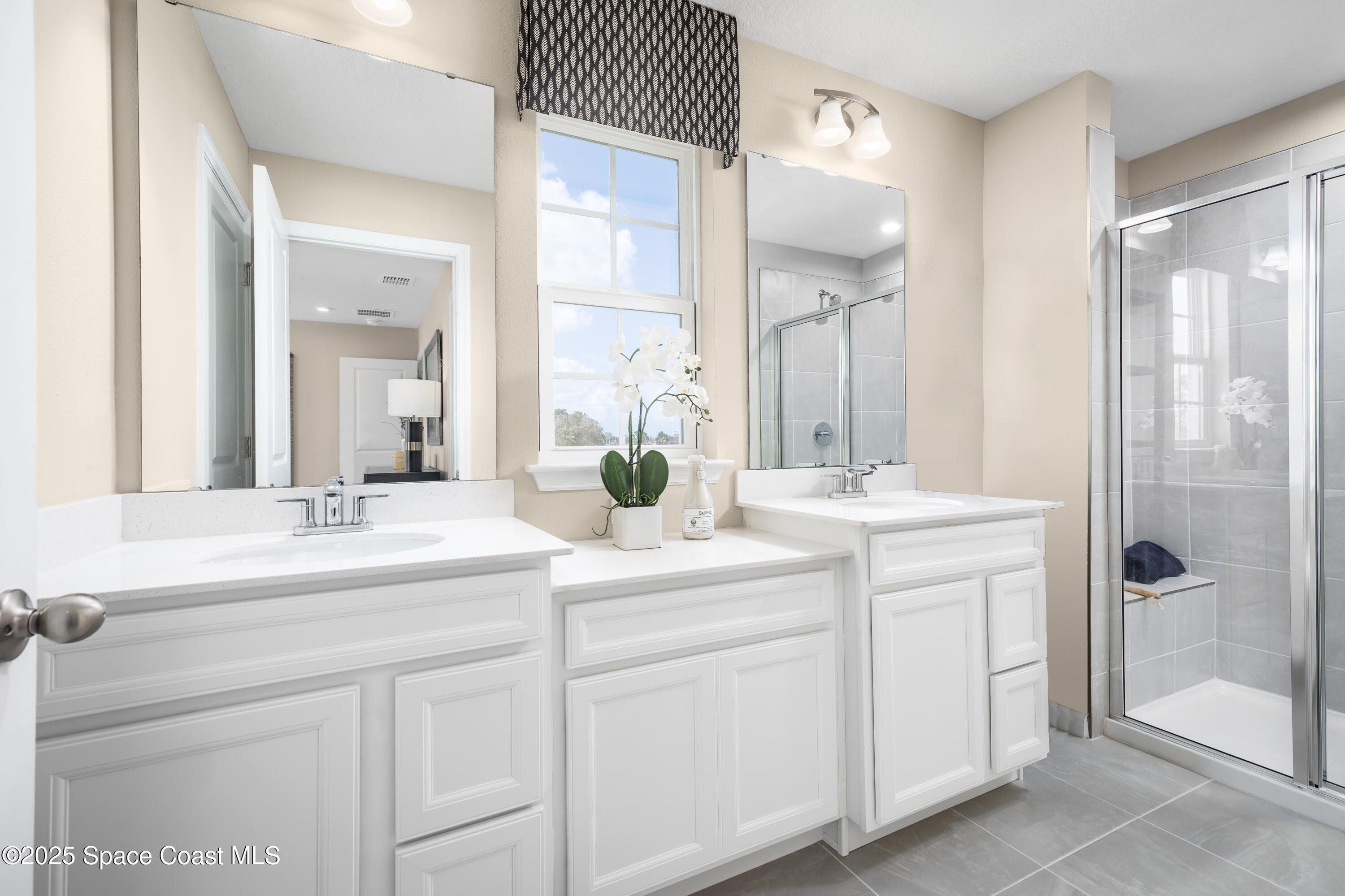 1808 Kendall Pointe Place Melbourne, FL 32935 - Photo 11 of 11 a bathroom with a sink and a mirror