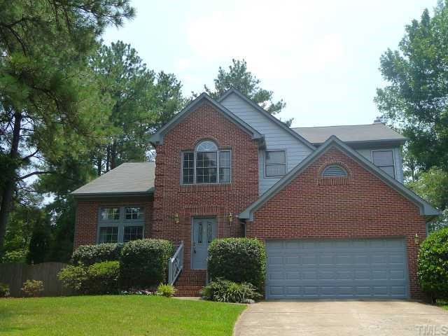 5321 Bakers Mill Road Durham, NC 27707 - Photo 1 of 12 a front view of a house with a yard and garage