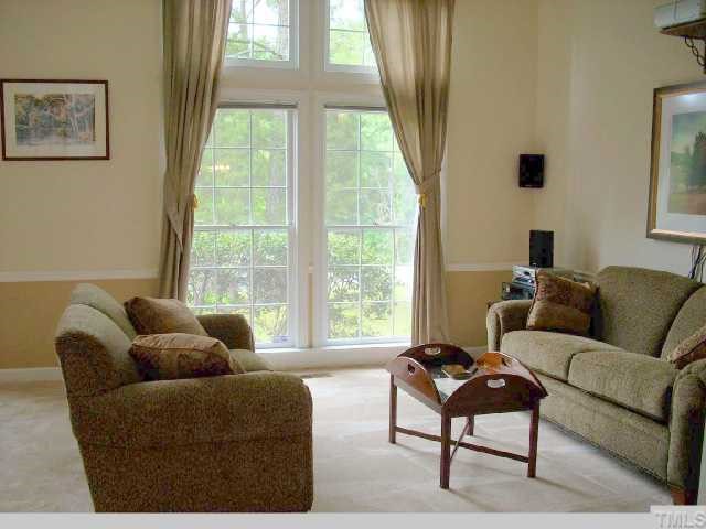 5321 Bakers Mill Road Durham, NC 27707 - Photo 3 of 12 a living room with furniture and a large window