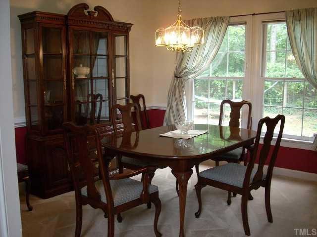 5321 Bakers Mill Road Durham, NC 27707 - Photo 4 of 12 a view of a dining room with furniture and chandelier