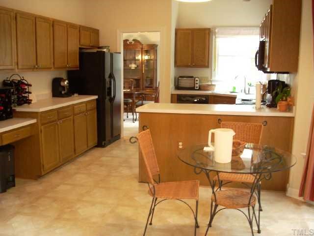 5321 Bakers Mill Road Durham, NC 27707 - Photo 5 of 12 a kitchen with a sink cabinets and window