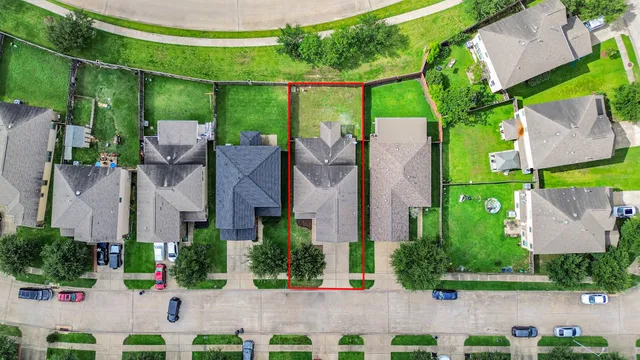 an aerial view of a house with a garden and plants