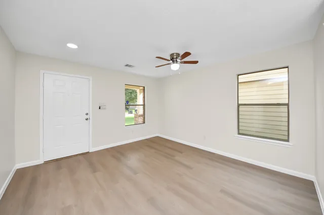 a view of an empty room with a window