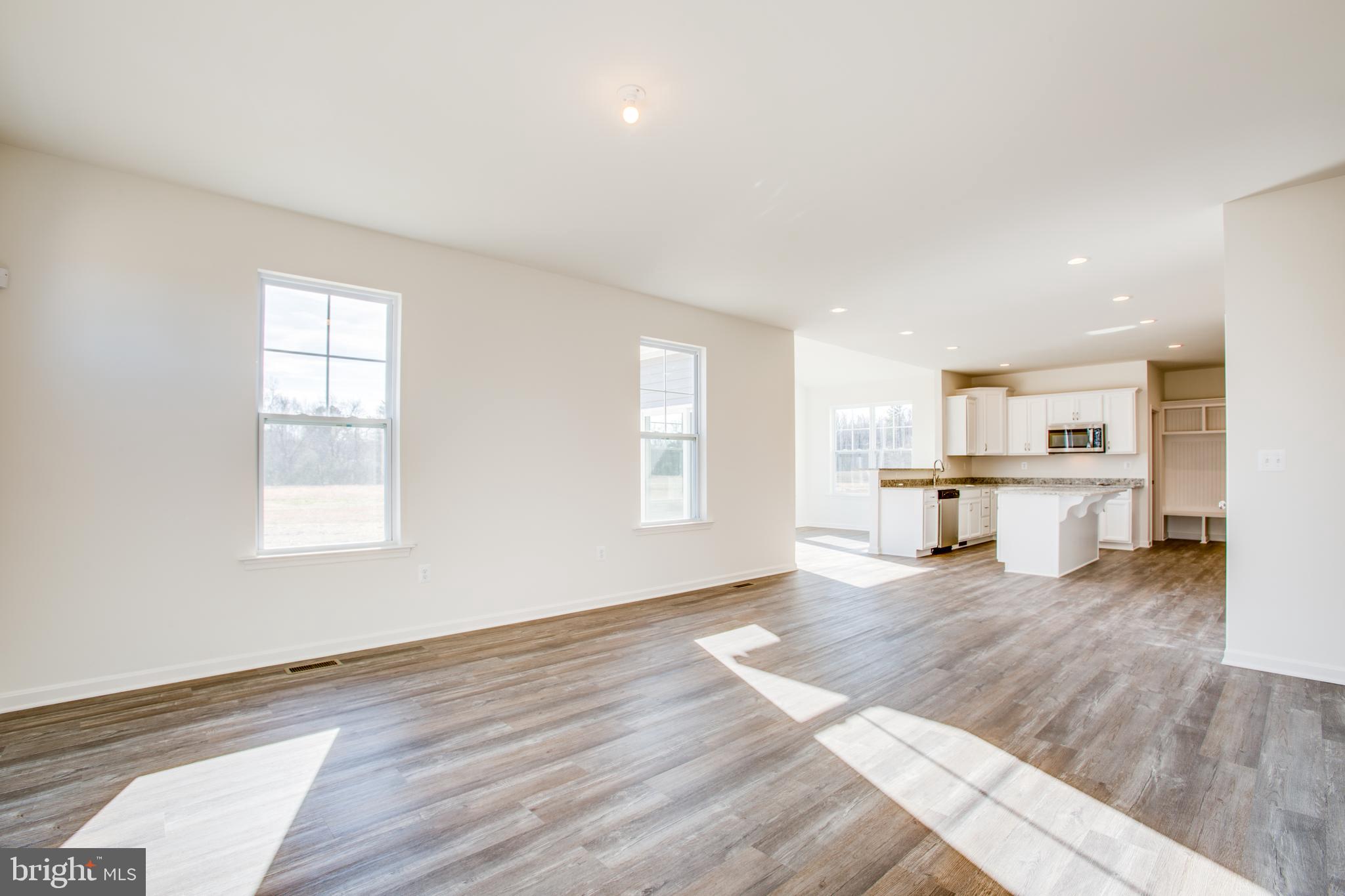2107 Warrenton Road Fredericksburg, VA 22406 - Photo 15 of 58 a view of a kitchen with wooden floor and a window