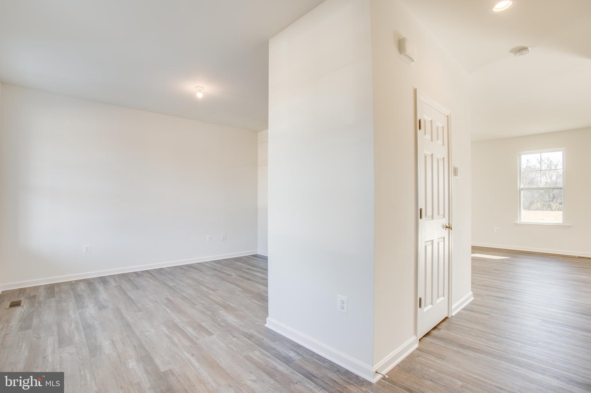 2107 Warrenton Road Fredericksburg, VA 22406 - Photo 17 of 58 a view of a hallway with wooden floor