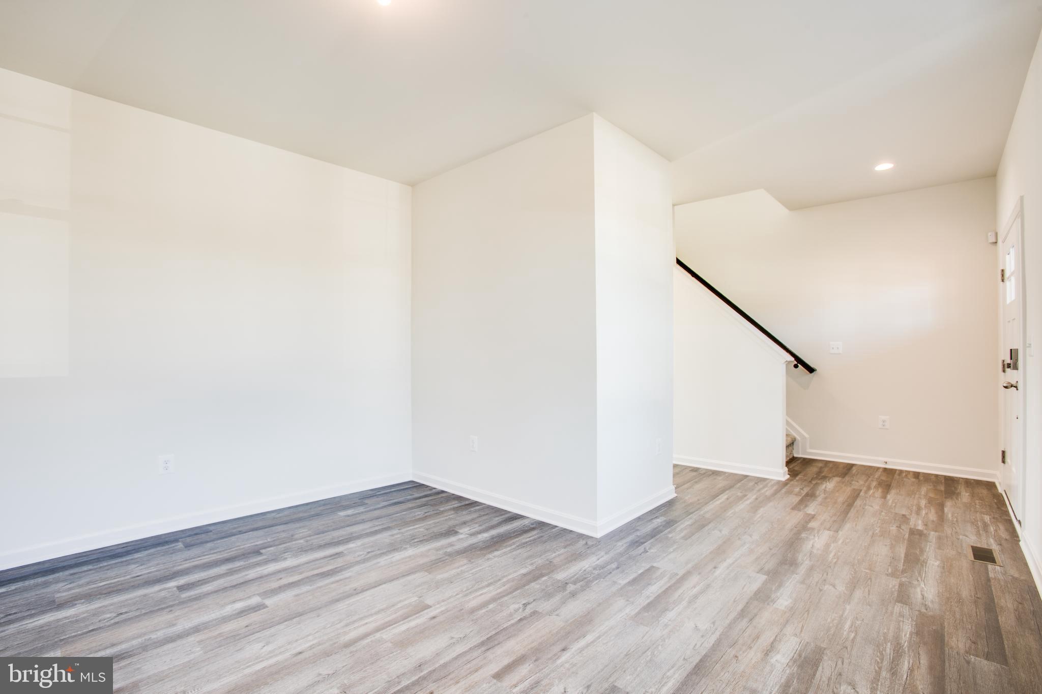 2107 Warrenton Road Fredericksburg, VA 22406 - Photo 18 of 58 a view of a room with wooden floor and white walls