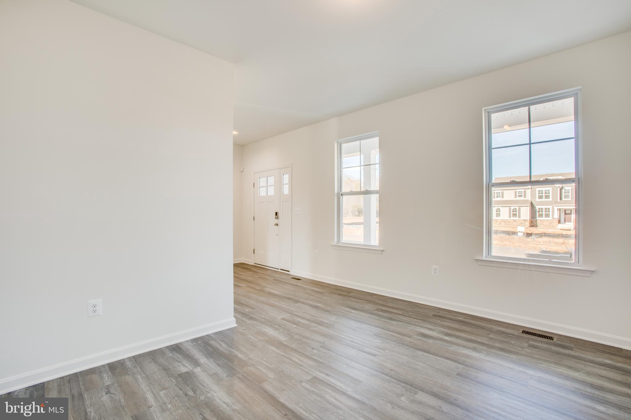 2107 Warrenton Road Fredericksburg, VA 22406 - Photo 19 of 58 an empty room with wooden floor and windows