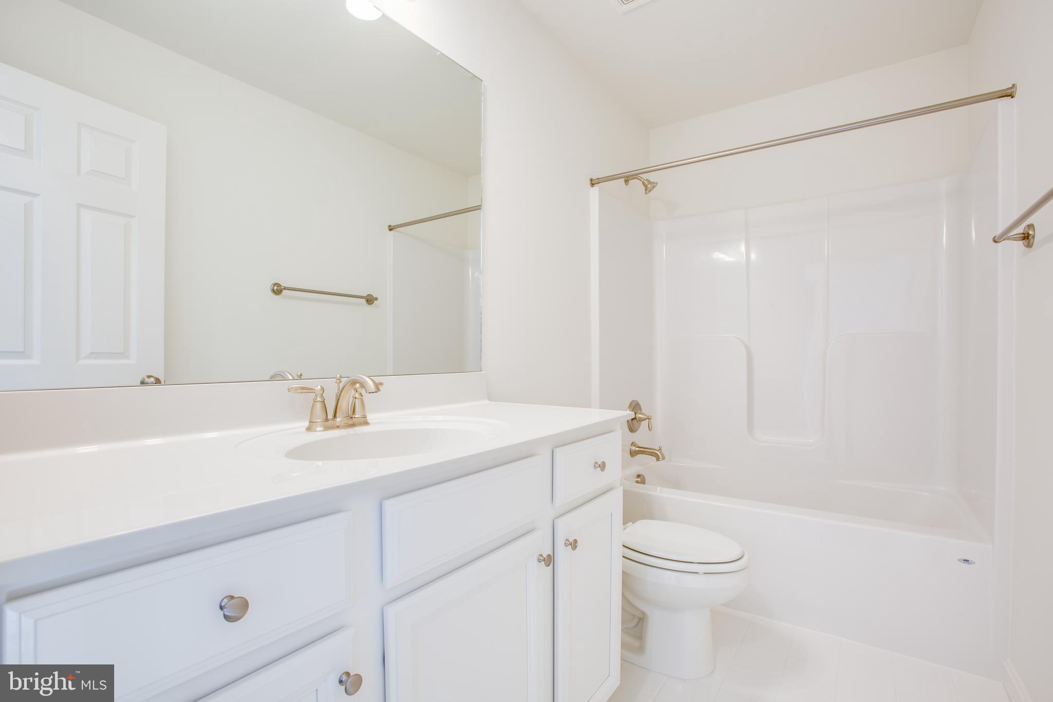 2107 Warrenton Road Fredericksburg, VA 22406 - Photo 43 of 58 a bathroom with a sink a toilet and shower