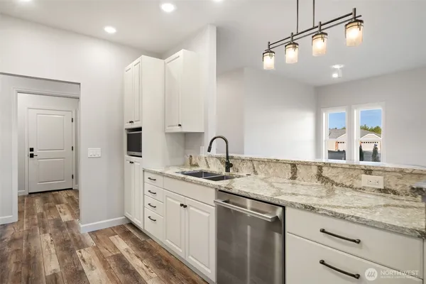 a view of a sink vanity granite and utility room