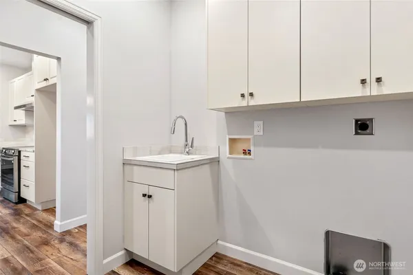 a bathroom with a sink and cabinets