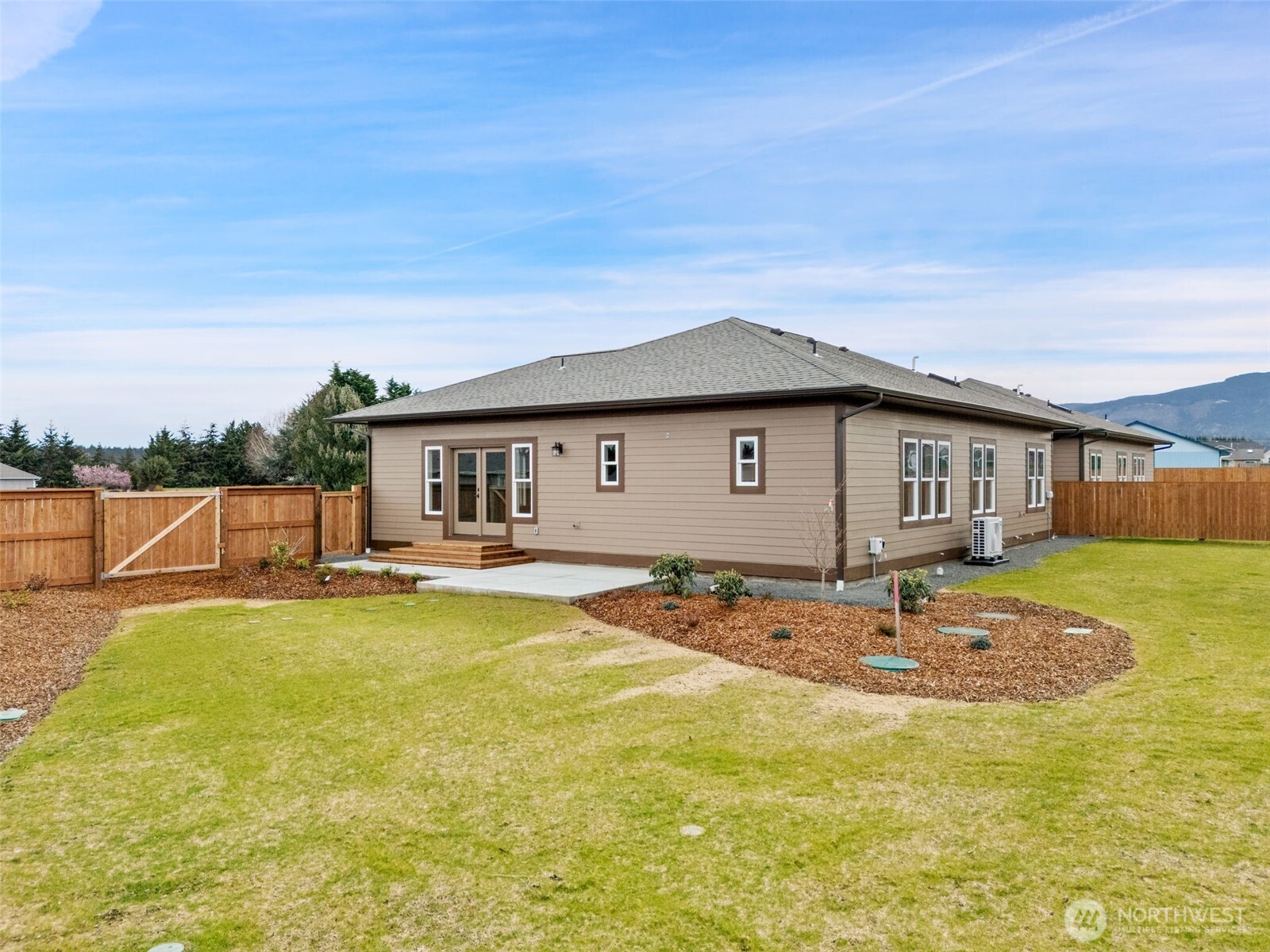 71 Heron Way, Unit A Sequim, WA 98382 - Photo 35 of 38 a view of a house with swimming pool and a yard