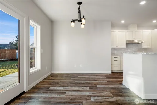 a view of a kitchen from the hallway