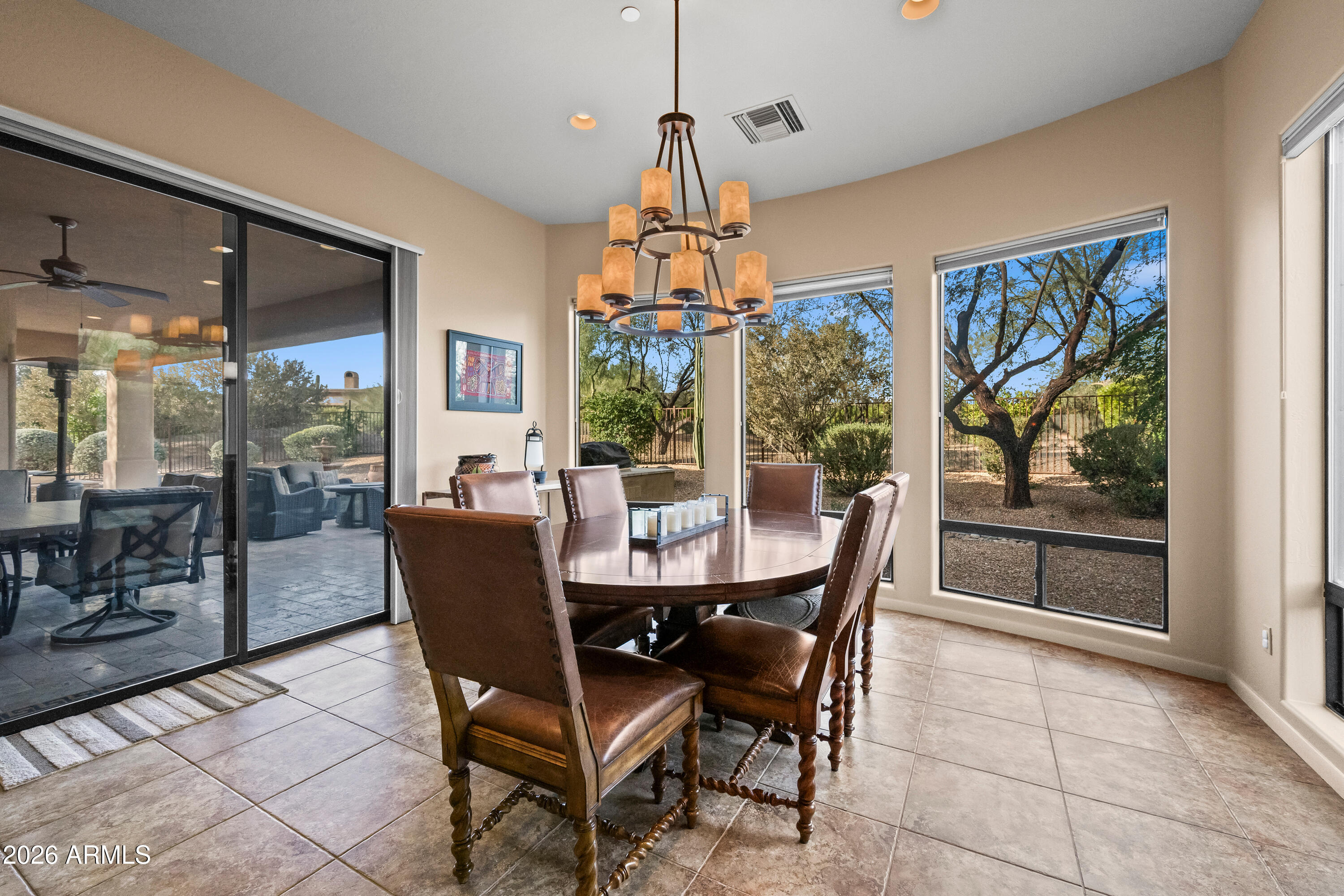 27940 North Walnut Creek Road Rio Verde, AZ 85263 - Photo 14 of 38 a dining room with furniture a chandelier and window