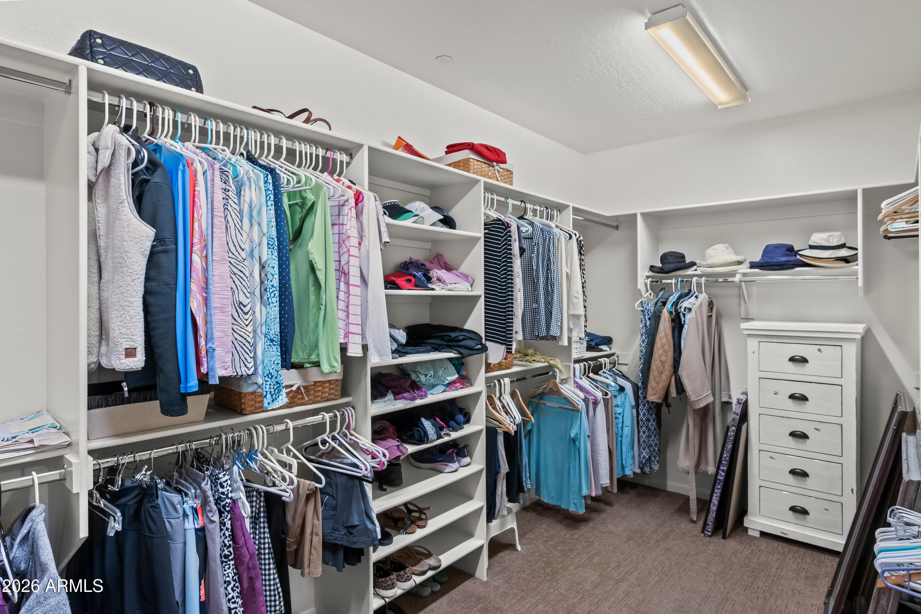 27940 North Walnut Creek Road Rio Verde, AZ 85263 - Photo 22 of 38 a view of walk in closet with clothes and shoes