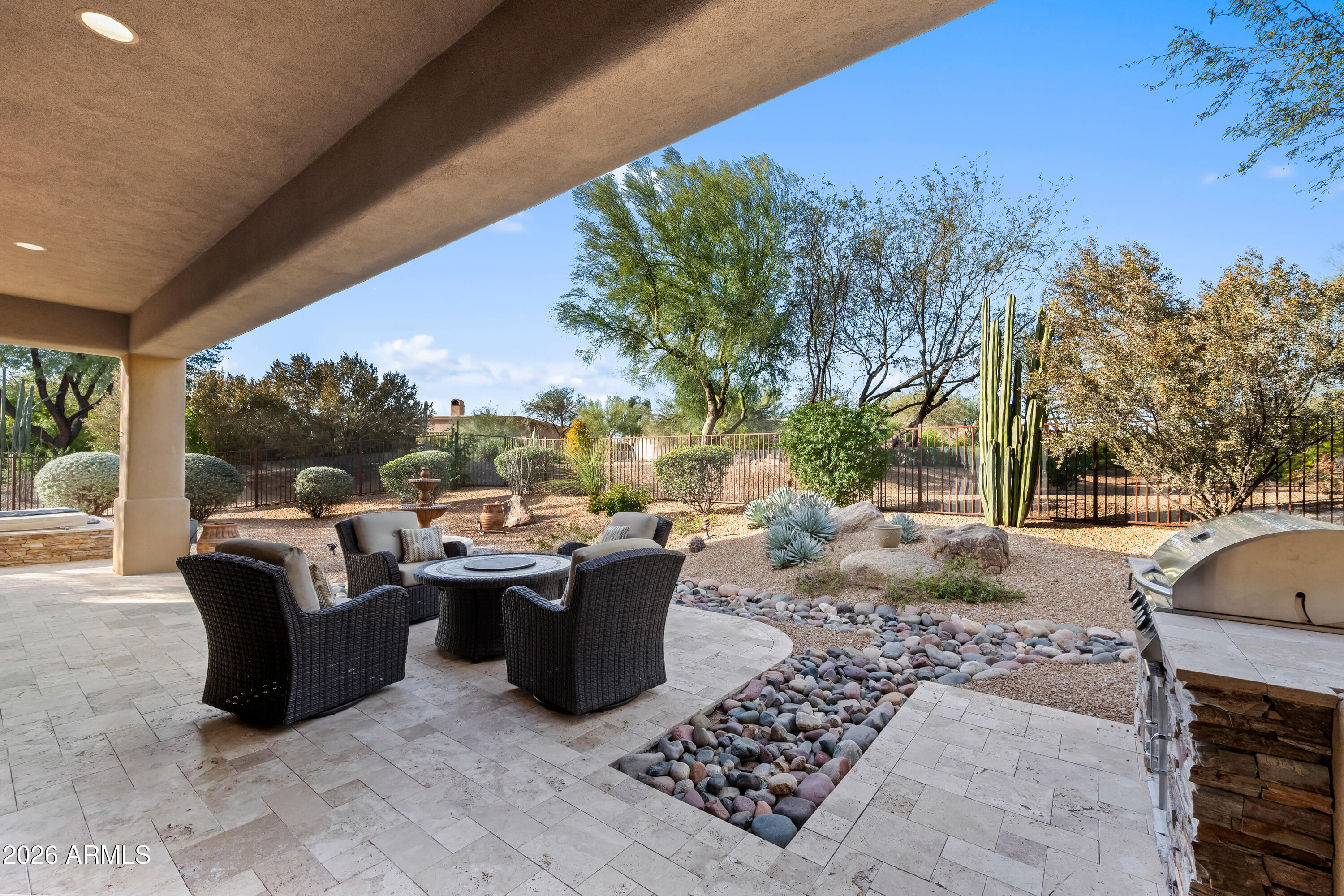 27940 North Walnut Creek Road Rio Verde, AZ 85263 - Photo 33 of 38 a view of a patio with couches plants and large trees