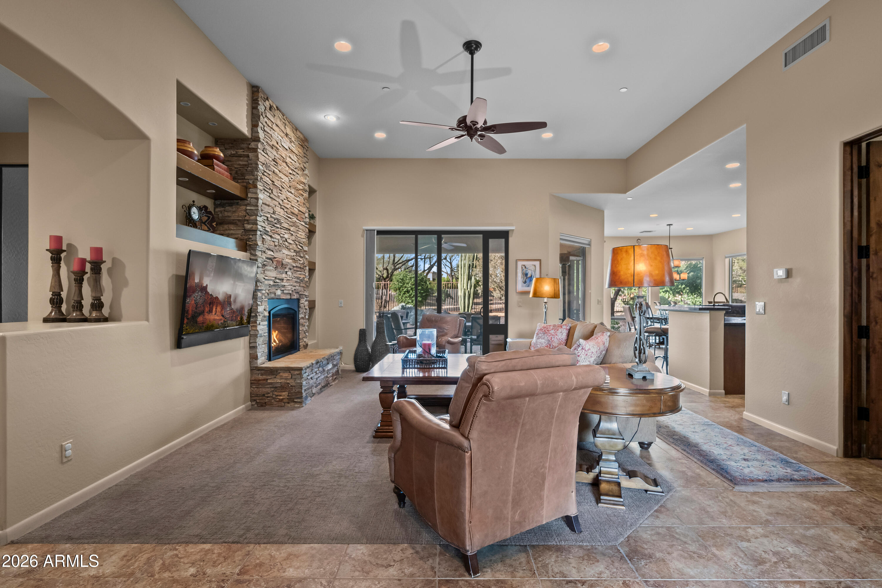 27940 North Walnut Creek Road Rio Verde, AZ 85263 - Photo 6 of 38 a living room with furniture and a flat screen tv