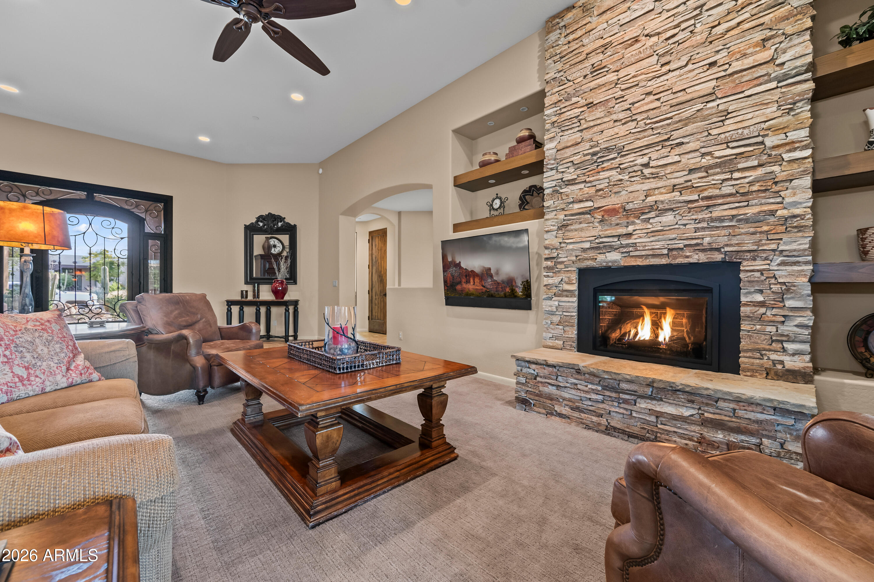 27940 North Walnut Creek Road Rio Verde, AZ 85263 - Photo 7 of 38 a living room with furniture and a fireplace