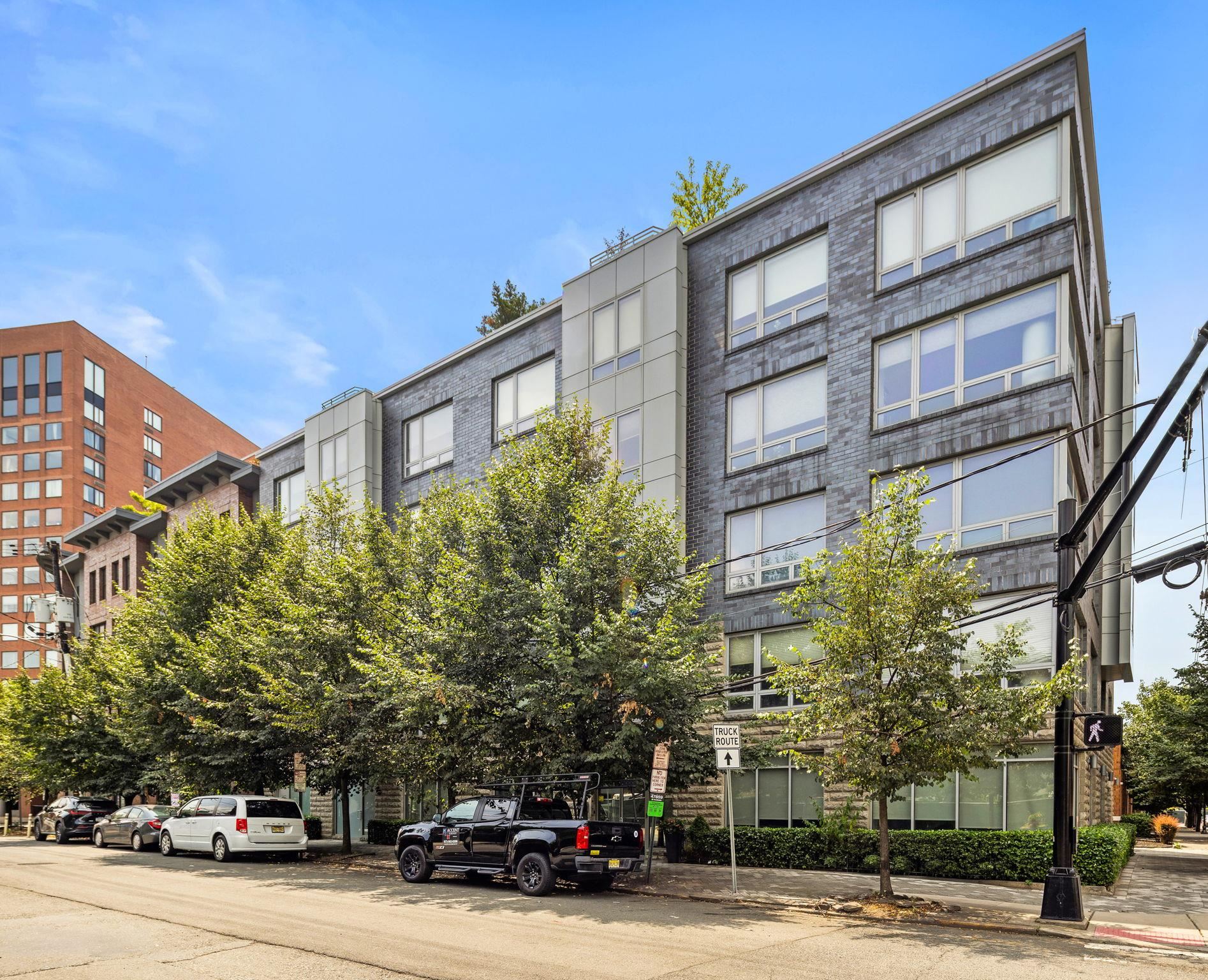 609 Observer Highway, Unit 303 Hoboken, NJ 07030 - Photo 17 of 20 a car parked in front of a building