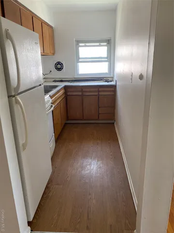 a kitchen with stainless steel appliances a refrigerator and a sink