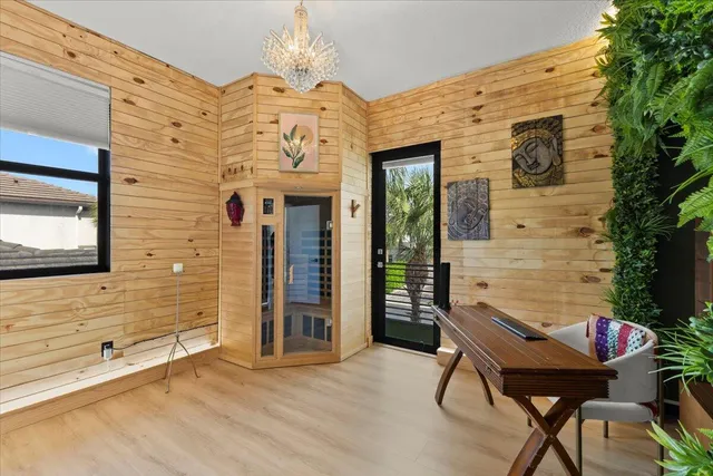 a balcony with table and chairs