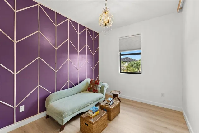 a room with a bed and a chandelier