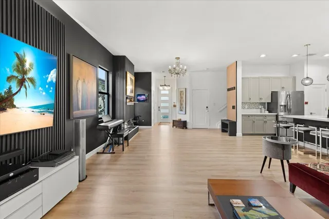 a living room with fireplace furniture and a flat screen tv