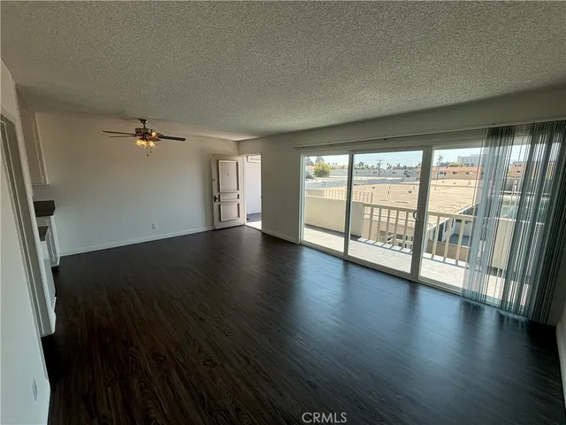 a kitchen with a stove sink and a refrigerator