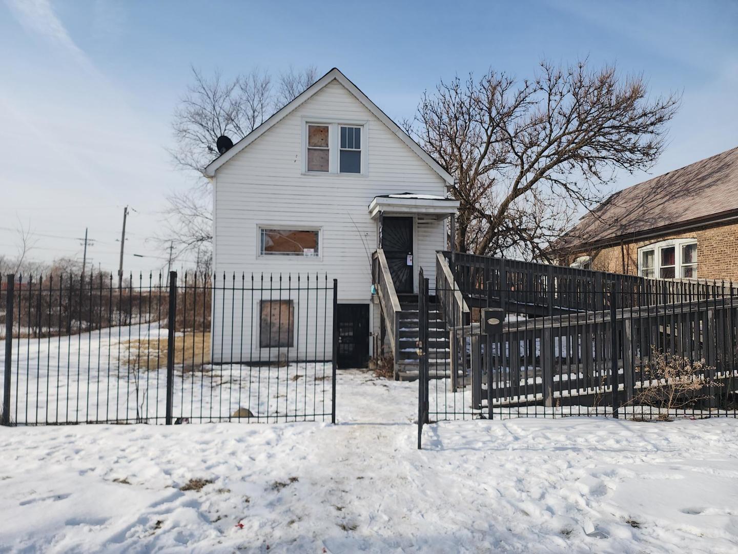 7434 South Oakley Avenue Chicago, IL 60636 - Photo 1 of 7 a view of a house with a snow in the backyard
