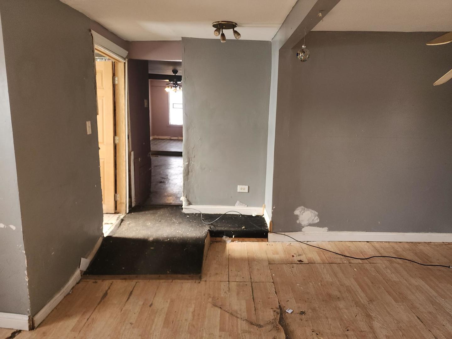 7434 South Oakley Avenue Chicago, IL 60636 - Photo 2 of 7 a bedroom with a bed and a rug