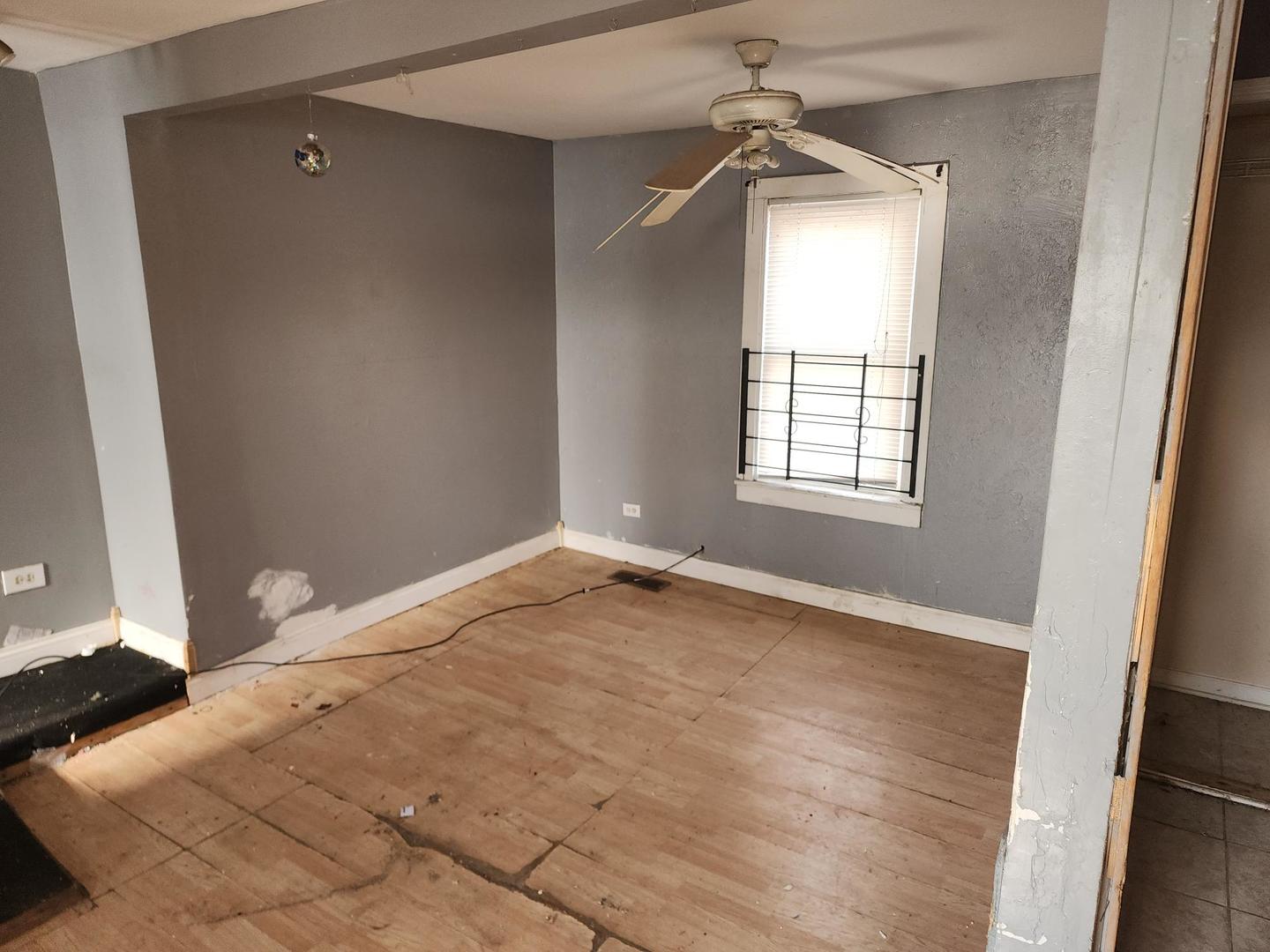 7434 South Oakley Avenue Chicago, IL 60636 - Photo 3 of 7 an empty room with windows and entrance