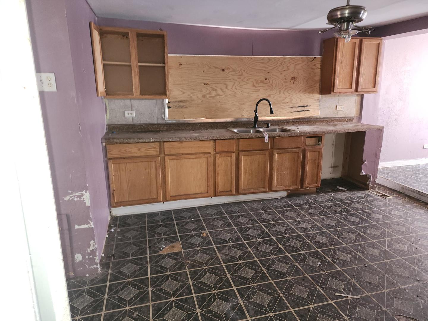 7434 South Oakley Avenue Chicago, IL 60636 - Photo 4 of 7 a bathroom with a sink a vanity and a mirror