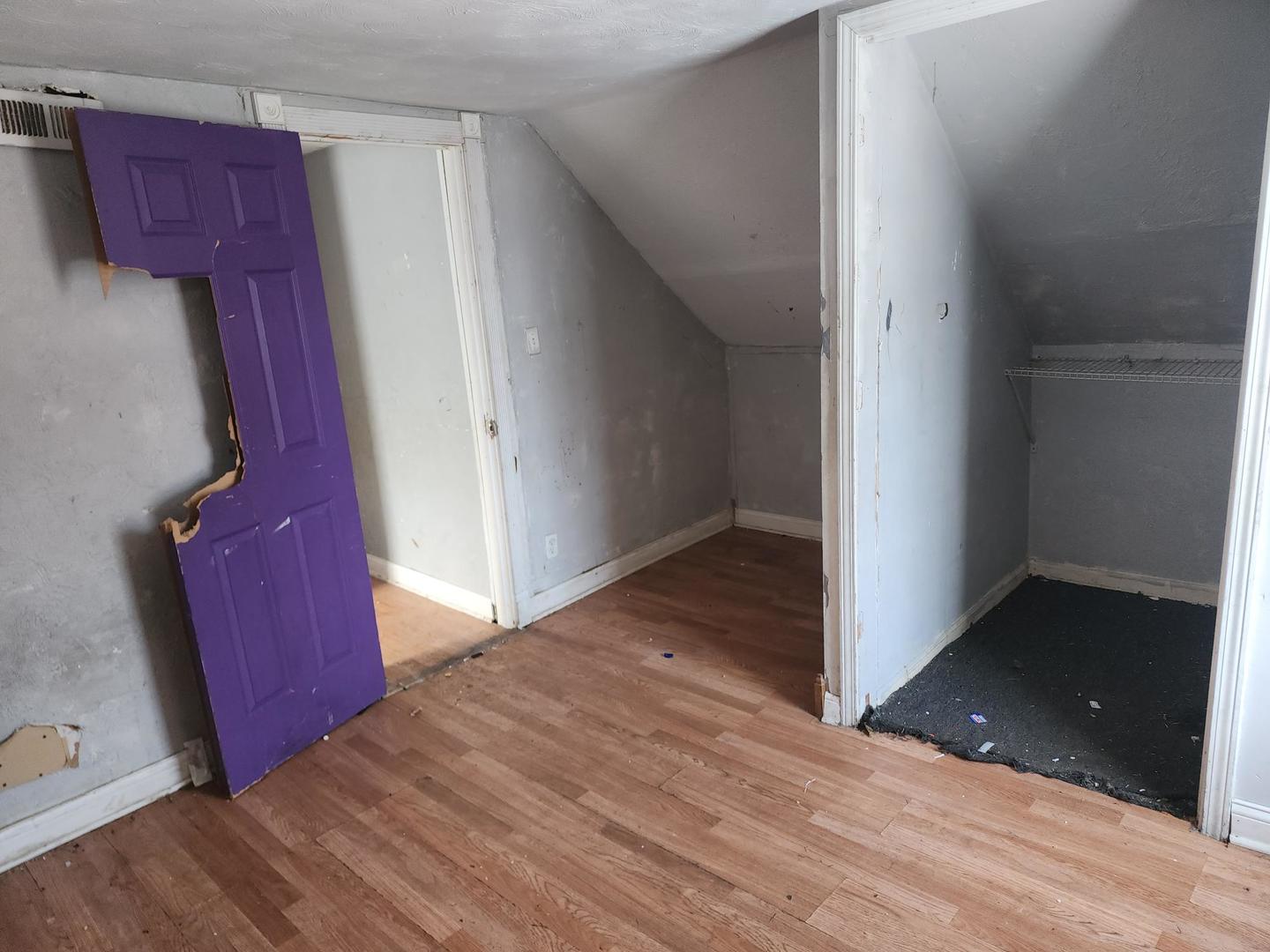 7434 South Oakley Avenue Chicago, IL 60636 - Photo 6 of 7 a view of a hallway with wooden floor and closet