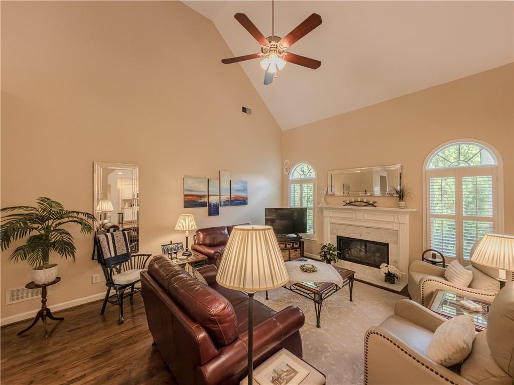4284 Cedar Bluff Way Southwest Lilburn, GA 30047 - Photo 20 of 62 a living room with furniture and a fireplace