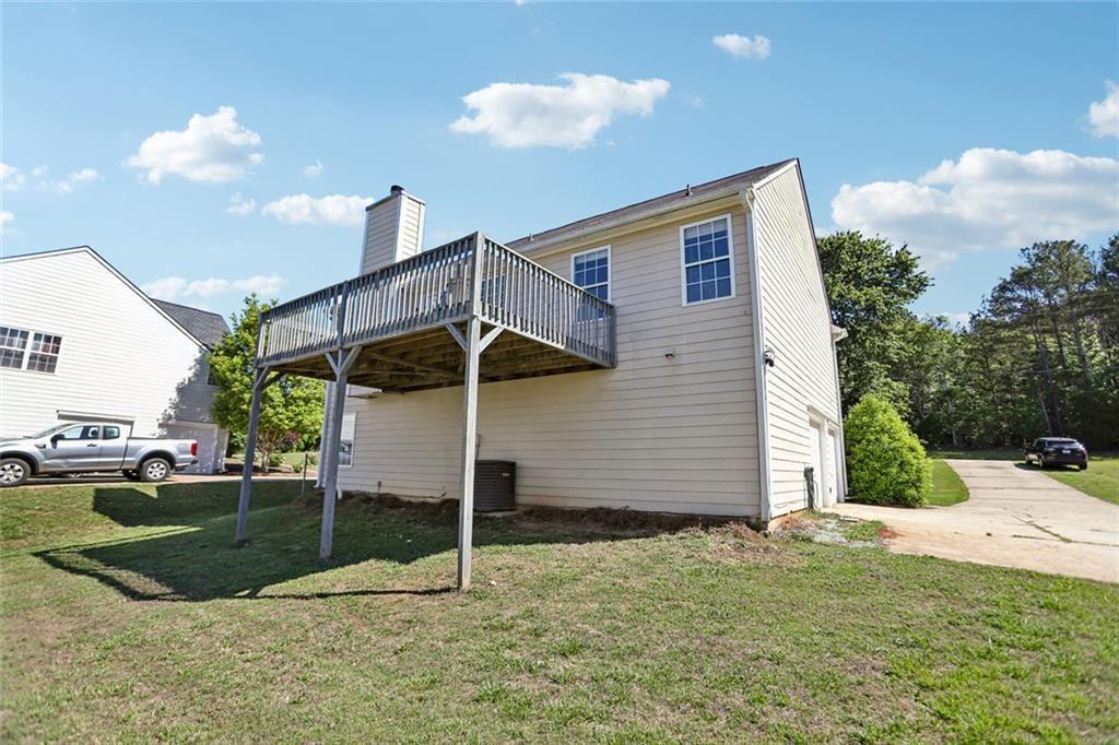9720 Poole Road Villa Rica, GA 30180 - Photo 37 of 40 a view of a house with a yard