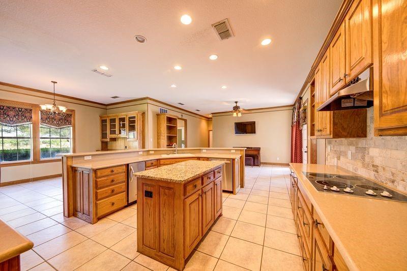 334 Farm To Market Road 2264 Decatur, TX 76234 - Photo 19 of 40 a kitchen with stainless steel appliances granite countertop a sink and cabinets
