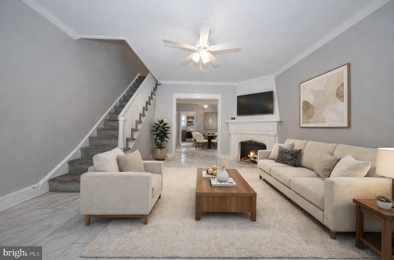 a living room with furniture and a fireplace
