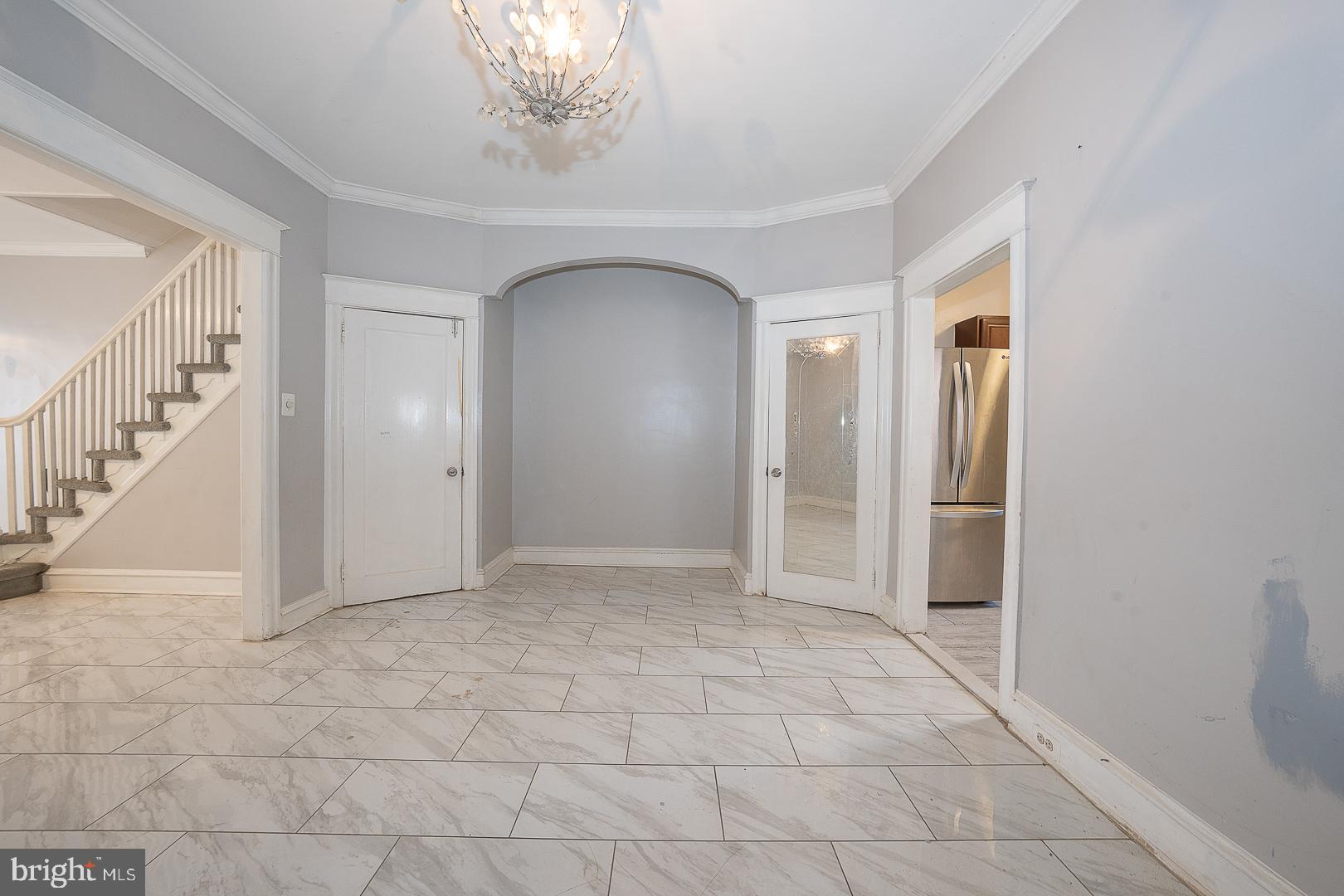 232 Copley Road Upper Darby, PA 19082 - Photo 14 of 47 a view of a hallway with entryway and chandelier